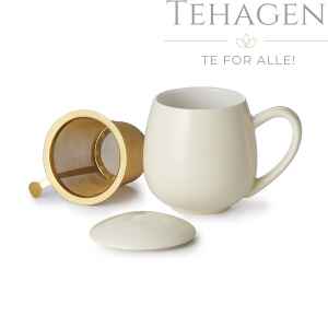 porselens tekopp med lokk og gyldent filter